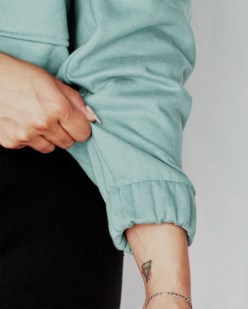 Buzo tipo Crop Aria Celeste